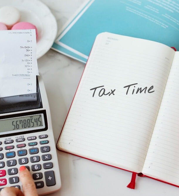 Advisor reviewing tax documents with a retiree